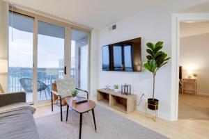 a living room with a couch and a table at Apartment with Panoramic City view of Ballston in Arlington