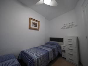 Postel nebo postele na pokoji v ubytování InmoSantos Oasis A1