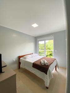 Ένα ή περισσότερα κρεβάτια σε δωμάτιο στο Hotel Du Rastro