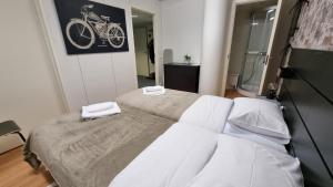 מיטה או מיטות בחדר ב-Aparthotel Clock 2