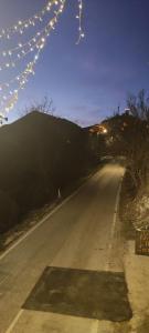 an empty road with christmas lights on it at B&B Nonno Severino in Santo Stefano di Sessanio