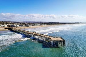 an aerial view of a pier on the beach at Vespera Resort on Pismo Beach, Autograph Collection in Pismo Beach