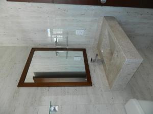 Baðherbergi á ACL Suites