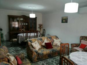 a living room with a couch and a table at casa el chiquitín in La Zubia