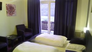 Postel nebo postele na pokoji v ubytování Villa Cornely + 11 fotografií