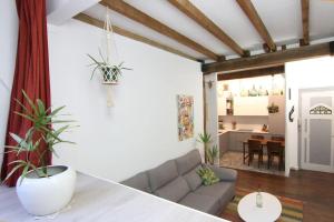 a living room with a couch and a table at La casa del árbol in Donostia-San Sebastián +14 photos