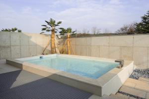 a large swimming pool in the backyard of a house at Stay O'on in Gyeongju