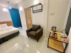 Voodi või voodid majutusasutuse Koimala Hotel toas