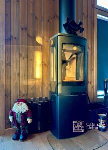 a teddy bear is sitting next to a television at New cabin with jacuzzi, sauna and ski inout in Svingvoll