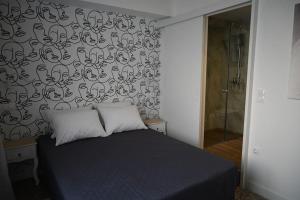 Cama o camas de una habitación en Haris 303 Apartment