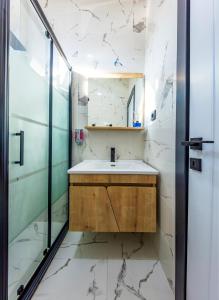 a bathroom with a sink and a shower at Mia Mia Suites in Istanbul