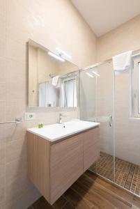 a bathroom with a sink and a shower at Aurelia Deluxe Suites in Rome