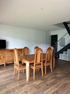 a dining room with a wooden table and chairs at Le Sailhet, maison de vacances in Pierrefitte-Nestalas