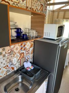 Η κουζίνα ή μικρή κουζίνα στο kit Net Recanto do Panda