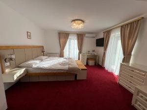Postel nebo postele na pokoji v ubytování PARC PINI RESORT