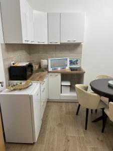 Kuchyň nebo kuchyňský kout v ubytování Apartmani Povlen 52