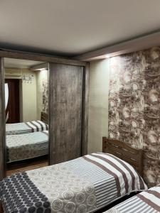 Postel nebo postele na pokoji v ubytování Guest House Imereti