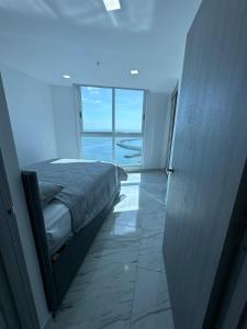 Postel nebo postele na pokoji v ubytování Unlimited Ocean View - The Sands + 9 fotografií