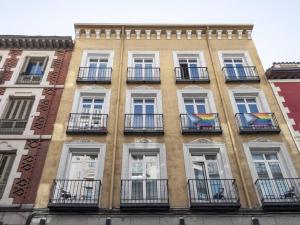 a tall building with balconies on the side of it at Apartamento en Puerta del Sol 2 in Madrid