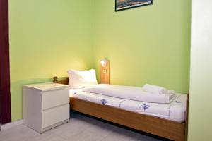 Postel nebo postele na pokoji v ubytování Ambiente by Next Inn