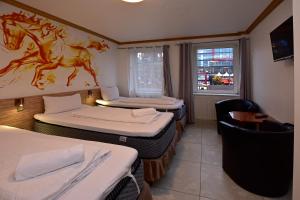 Postel nebo postele na pokoji v ubytování Ambiente by Next Inn