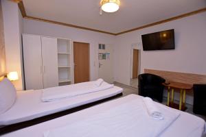 Postel nebo postele na pokoji v ubytování Ambiente by Next Inn