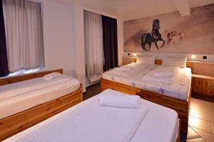 Postel nebo postele na pokoji v ubytování Ambiente by Next Inn