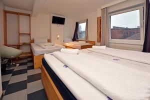 Postel nebo postele na pokoji v ubytování Ambiente by Next Inn