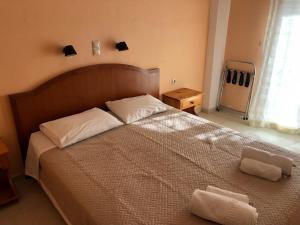 Postel nebo postele na pokoji v ubytování Babis Hotel