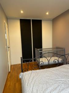 Ένα ή περισσότερα κρεβάτια σε δωμάτιο στο Appartement à Beaune avec Parking +5 φωτογραφίες