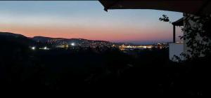 a view of a city at night at Nest next to the center in Mytilene