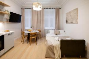 Ένα ή περισσότερα κρεβάτια σε δωμάτιο στο Raina Boulevard Exclusive Design Apartments by the Park