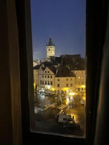 a view from a window of a city at night at Kafka Prague rooms in Prague