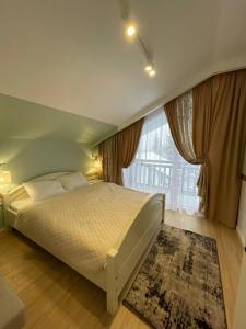 Postel nebo postele na pokoji v ubytování Horizon Apartmens