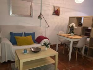 a living room with a couch and a table at Casa Rodríguez - La Herradura in La Herradura