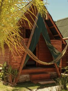 a gazebo with a hammock in front of it at Valhalla Glamping House in Bombinhas