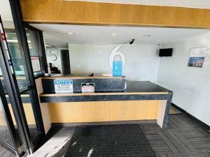 a lobby with a ticket counter in a building at Motel 6-Cedar Rapids, IA in Cedar Rapids
