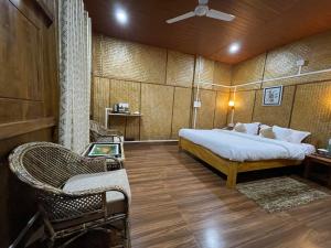 Ένα ή περισσότερα κρεβάτια σε δωμάτιο στο Kaziranga Eco Camp