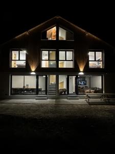 a large house at night with lights on it at Le Paradis Blanc luxueux Chalet Spa Serre-Chevalier in La Salle-les-Alpes