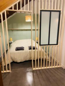 a bedroom with a bunk bed with a window at Appartement centre ville Caen Vaugueux in Caen