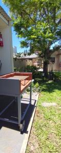 a barbecue cart sitting outside of a house at Casa D a 2 - Con Parrilla - Centro de Federación in Federación