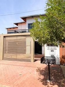 a large building with a large roll up garage at Casa conforto e estilo in Palmas