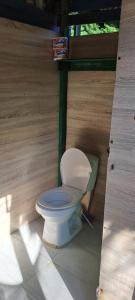 a toilet sitting inside of a wooden structure at Vista Linda Cabaña in Playa Blanca
