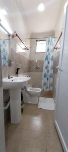 a bathroom with a sink and a toilet at vienna Greenwood 3bd massionate mombasa pool.deck wifi in Mtwapa