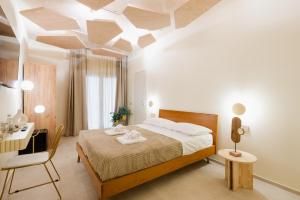 Postel nebo postele na pokoji v ubytování Porta D'Oro Charming House II & Spa
