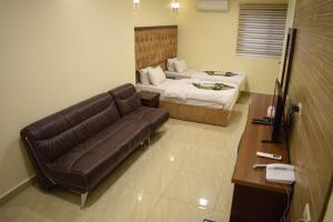 Postel nebo postele na pokoji v ubytování Nour Hotel + 18 fotografií