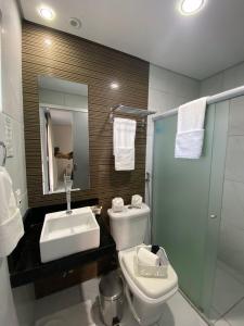 a bathroom with a sink and a toilet and a shower at Marina Noronha Pousada in Fernando de Noronha +14 photos