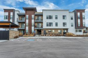 an empty parking lot in front of a building at Newly Built Modern Park City Getaway l Zen by Stay in Park City