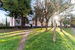 Сад в 034- Tropisme, Appart 2 chambres, Clim, Wifi, Parking