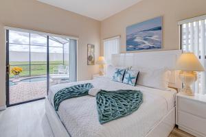 a bedroom with a bed and a large window at Dream Villa - New 4BR/3BA - 6 Miles From Disney in Orlando +42 photos